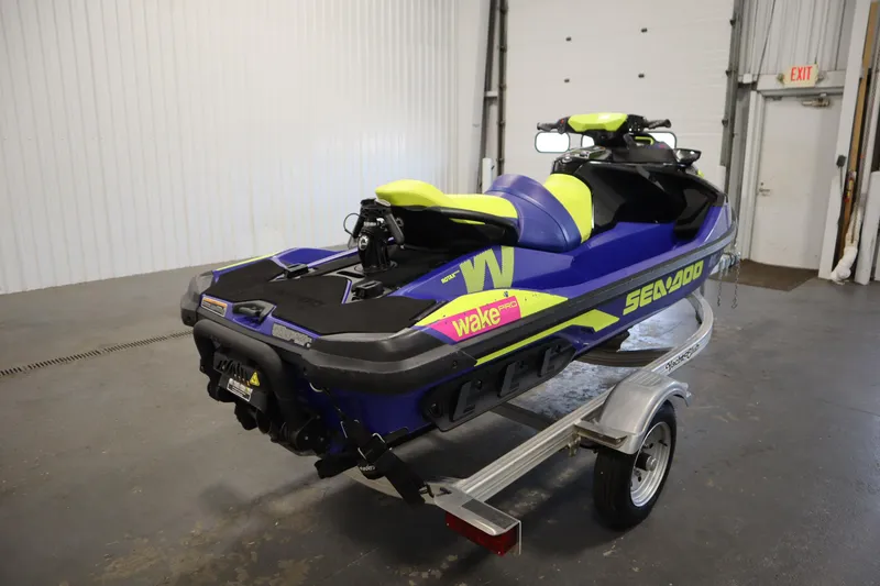 Slide: The Image of 2020 Sea-Doo Wake Pro 230 jet ski on trailer in indoor setting. - 5