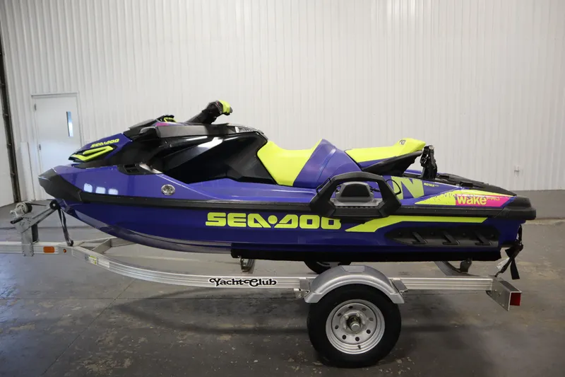 Slide: The Image of 2020 Sea-Doo Wake Pro 230 jet ski on trailer in indoor setting. - 8