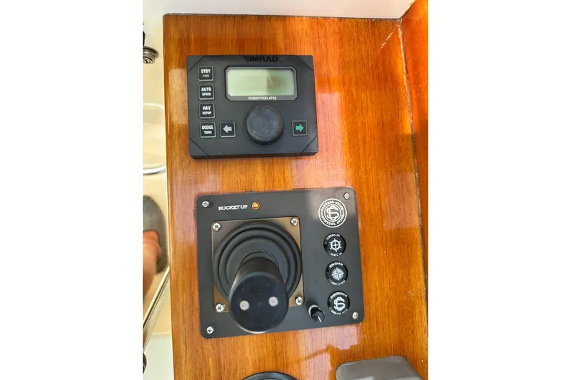 Slide: The Image of Hinckley Picnic Boat 36 (2000) control panel with Simrad autopilot and joystick. - 29