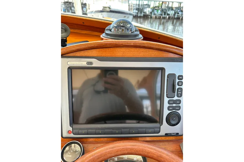 Slide: The Image of Hinckley Picnic Boat 36 dashboard with navigation system and compass, 2000 model. - 32