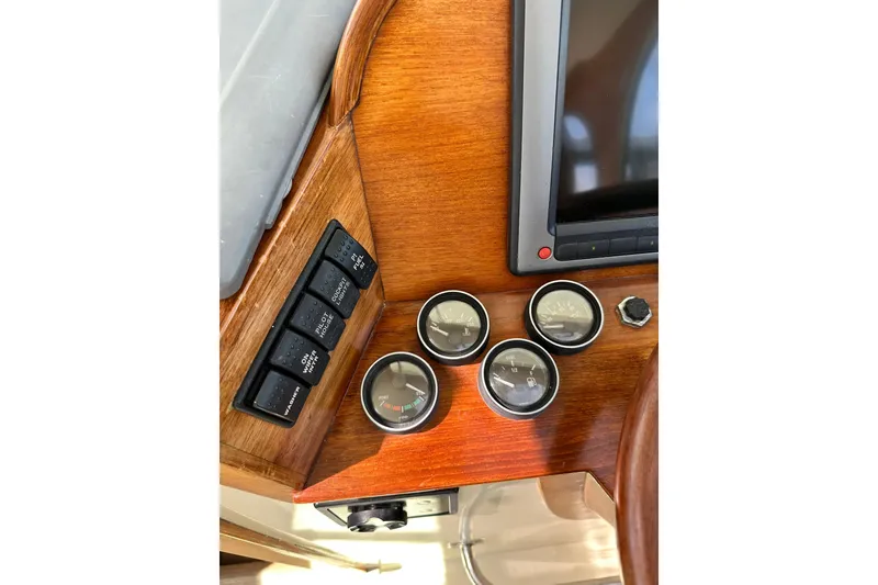 Slide: The Image of Hinckley Picnic Boat 36 dashboard with gauges and controls, 2000 model. - 33