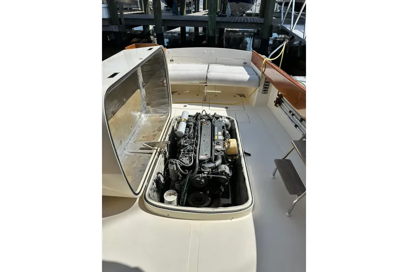 Slide: The Image of Hinckley Picnic Boat 36 (2000) engine compartment with open hatch, dockside view. - 38
