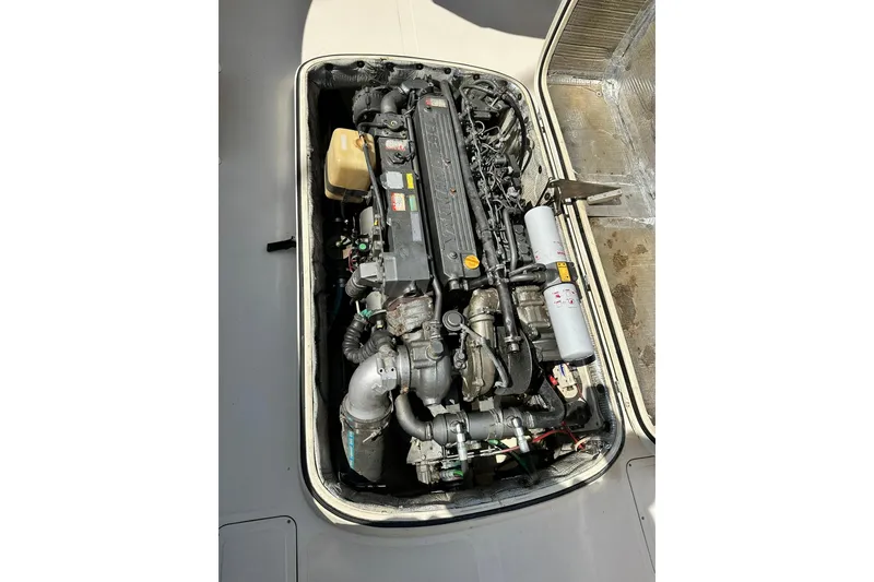 Slide: The Image of Engine compartment of a 2000 Hinckley Picnic Boat 36, showcasing detailed mechanical components. - 36