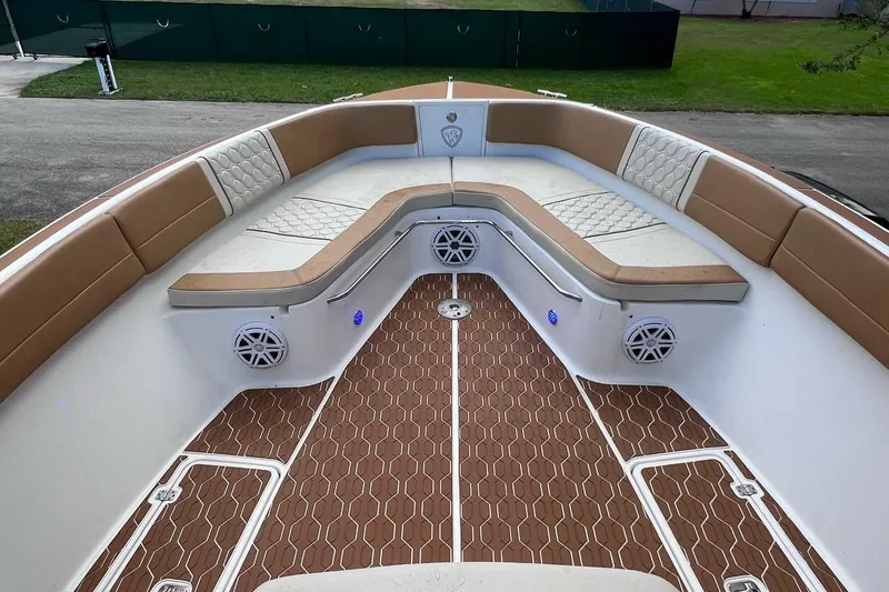 Slide: The Image of 2019 Century 3200 Center Console boat with cushioned seating and stylish deck design. - 3