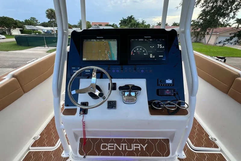 Slide: The Image of 2019 Century 3200 Center Console boat dashboard with navigation and control systems. - 4