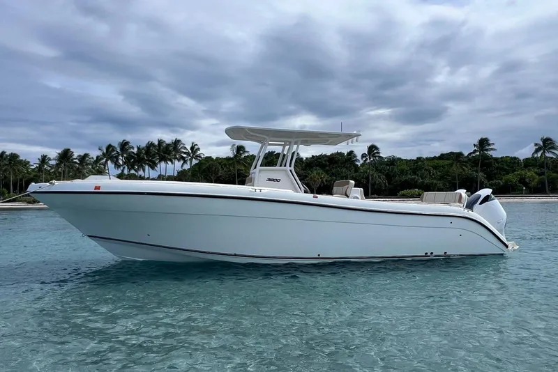 Slide: The Image of 2019 Century 3200 Center Console boat on clear tropical waters with palm trees in background. - 9