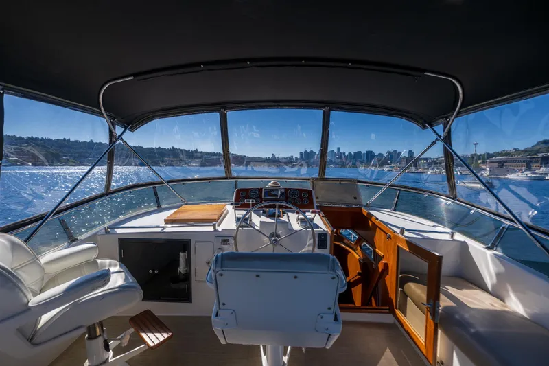 Slide: The Image of Interior view of 1995 Ocean Alexander 486 Classicco Pilothouse with city skyline in background. - 14
