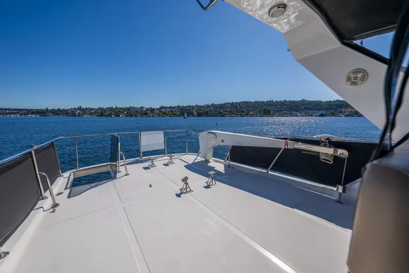 Slide: The Image of 1995 Ocean Alexander 486 Classicco Pilothouse yacht deck with scenic water view. - 16