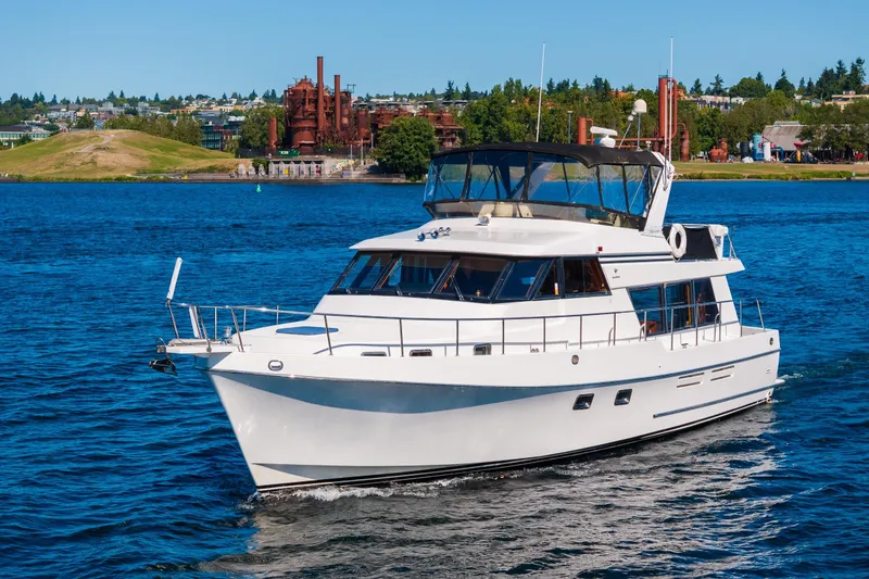 Slide: The Image of Port side view of 1995 Ocean Alexander 486 Classicco Pilothouse yacht cruising on a sunny day. - 2
