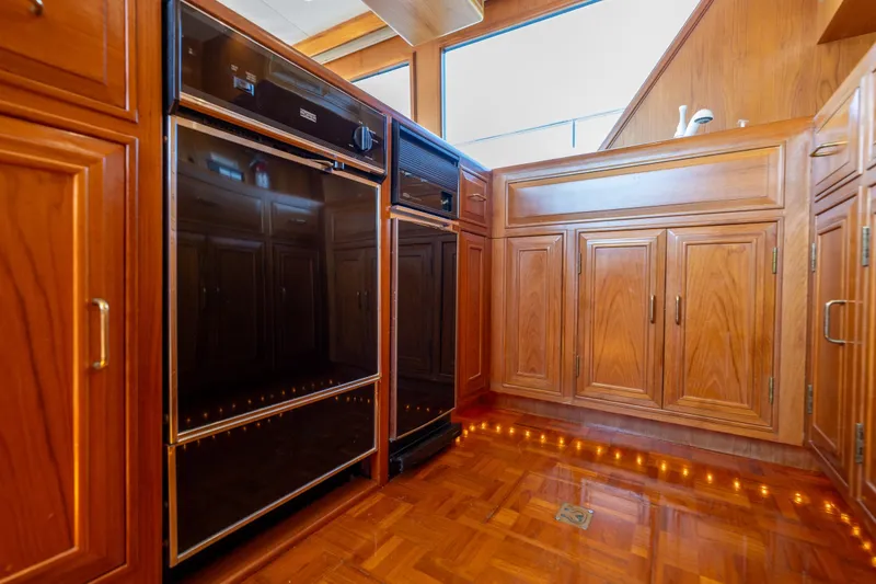Slide: The Image of Luxurious wooden kitchen interior on 1995 Ocean Alexander 486 Classicco Pilothouse yacht. - 20