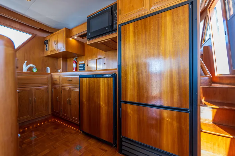 Slide: The Image of Luxurious wooden interior of 1995 Ocean Alexander 486 Classicco Pilothouse yacht kitchen. - 21