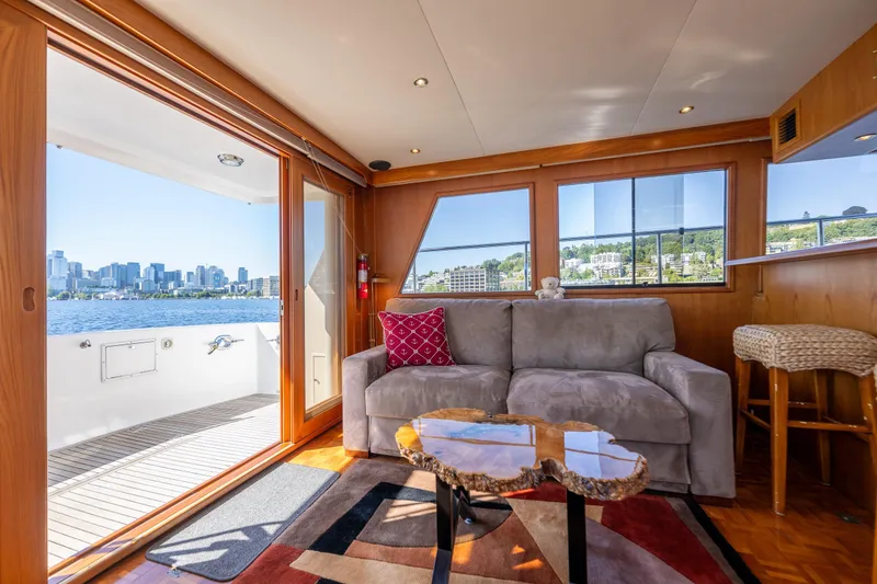 Slide: The Image of Luxurious 1995 Ocean Alexander 486 Classicco Pilothouse interior with waterfront city view. - 23