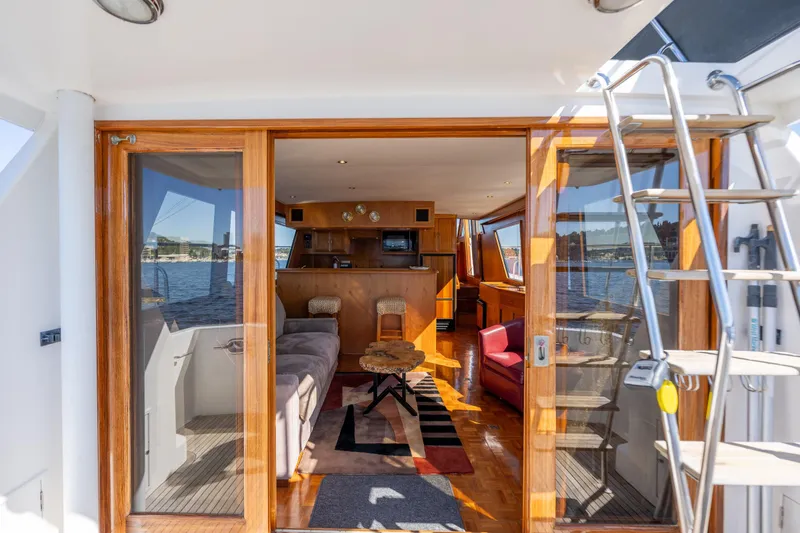 Slide: The Image of Interior view of 1995 Ocean Alexander 486 Classicco Pilothouse yacht with wooden accents. - 24