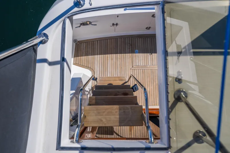 Slide: The Image of Staircase view on 1995 Ocean Alexander 486 Classicco Pilothouse yacht with wooden deck. - 25