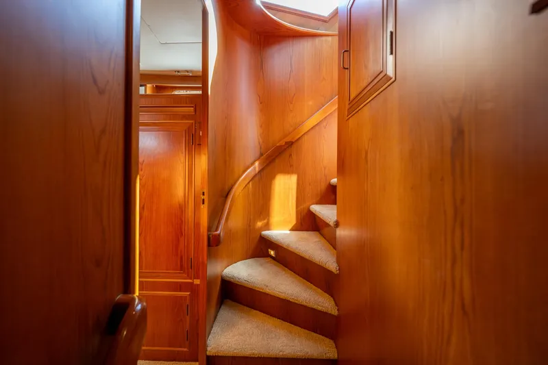 Slide: The Image of Interior of 1995 Ocean Alexander 486 Classicco Pilothouse with wooden staircase and paneling. - 28
