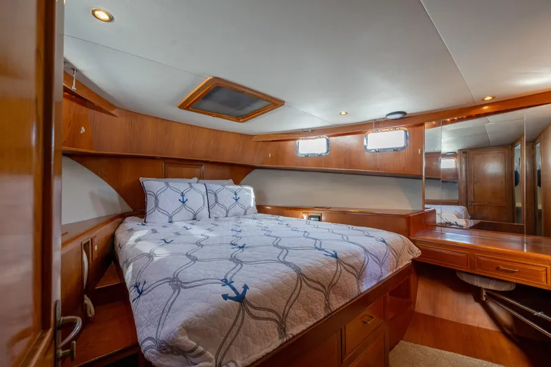 Slide: The Image of Luxurious 1995 Ocean Alexander 486 Classicco Pilothouse bedroom with rich Teak wood paneling. - 37