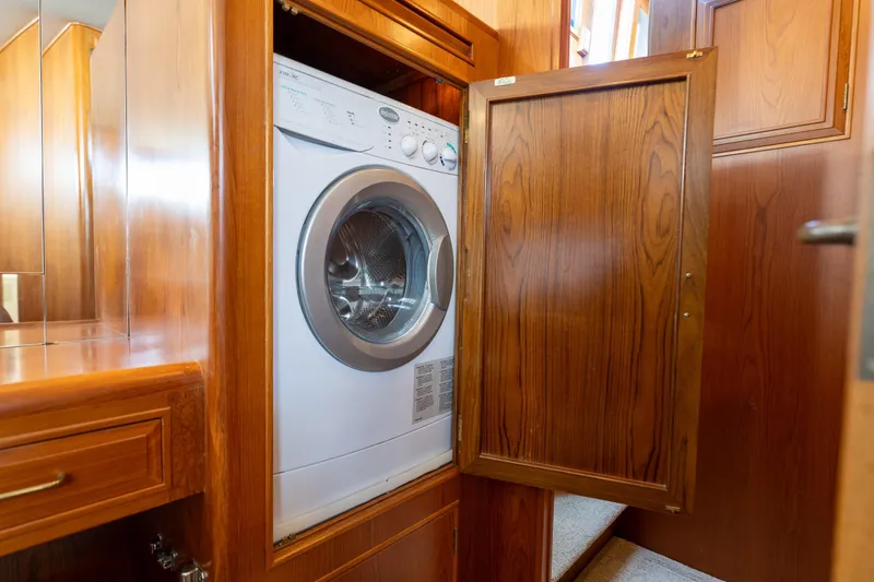 Slide: The Image of Laundry area with a washing machine in a 1995 Ocean Alexander 486 Classicco Pilothouse. - 40