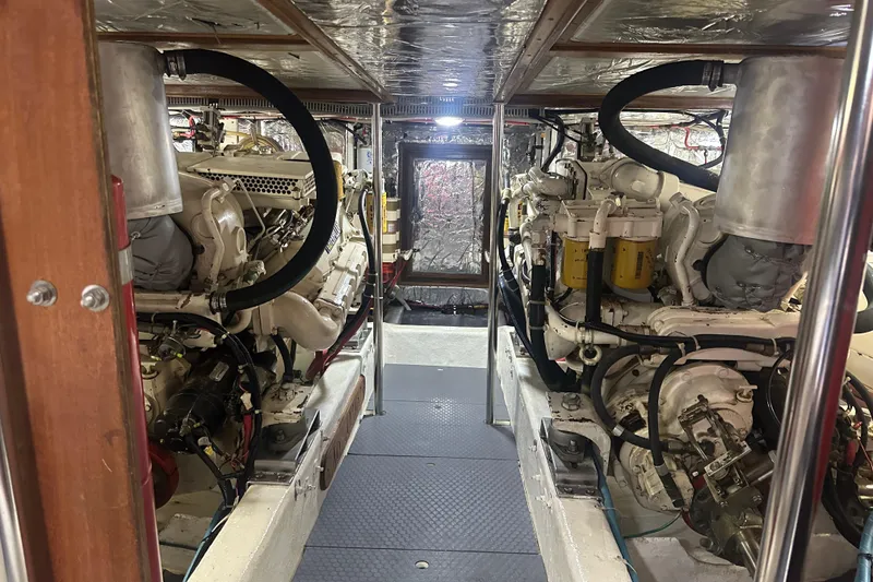 Slide: The Image of Engine room of 1995 Ocean Alexander 486 Classicco Pilothouse yacht, showcasing dual engines. - 43