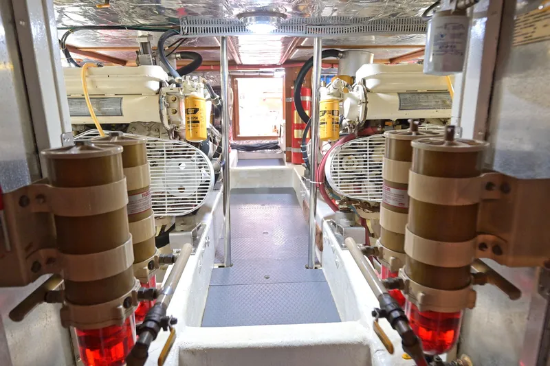 Slide: The Image of Engine room of 1995 Ocean Alexander 486 Classicco Pilothouse with visible machinery and components. - 44