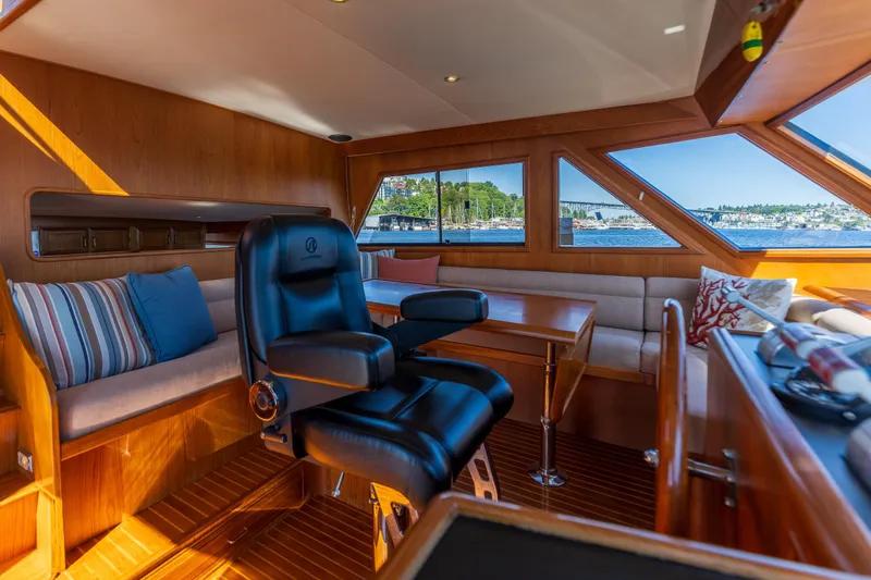 Slide: The Image of Luxurious 1995 Ocean Alexander 486 Classicco Pilothouse interior with plush Stidd Helm seat and scenic views. - 5