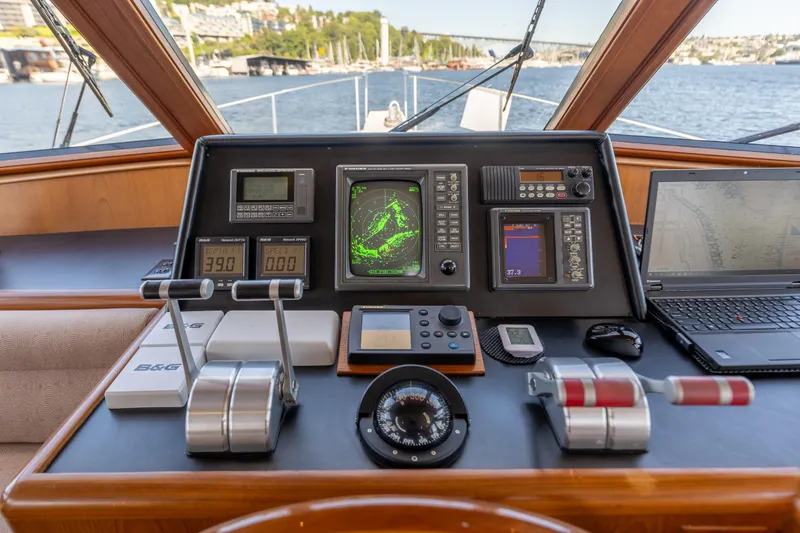 Slide: The Image of Pilothouse of 1995 Ocean Alexander 486 Classicco, featuring navigation equipment and controls. - 6