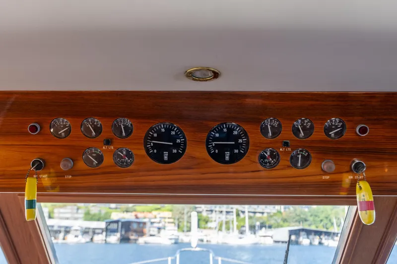 Slide: The Image of 1995 Ocean Alexander 486 Classicco Pilothouse dashboard with gauges and controls. - 8