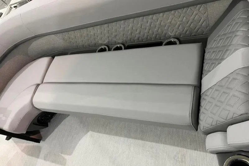 Slide: The Image of 2025 Bennington 24MSB boat interior with luxurious gray seating and cup holders. - 2