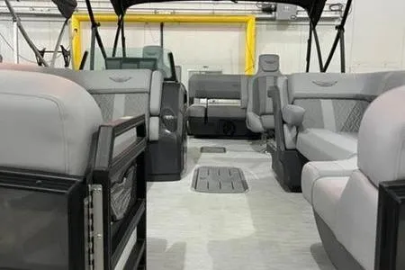 Slide: The Image of 2025 Bennington 24MSB pontoon boat interior with spacious seating and modern design. - 5