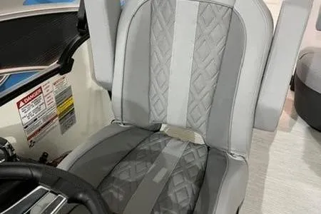 Slide: The Image of 2025 Bennington 24MSB boat seat with gray quilted upholstery and sleek design. - 6