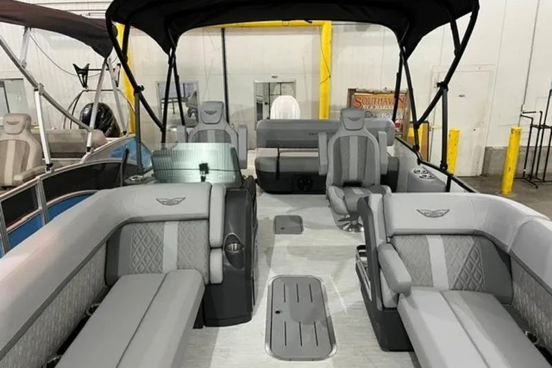 Slide: The Image of 2025 Bennington 24MSB pontoon boat interior with gray seating and canopy. - 7