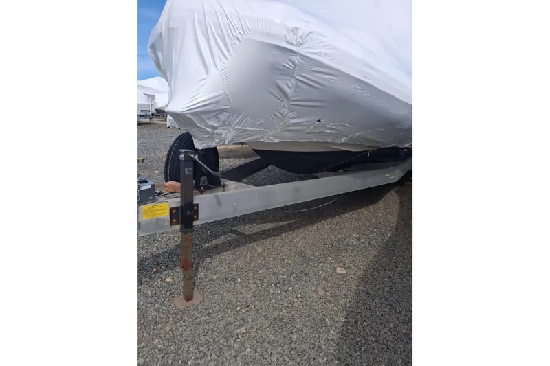 Slide: The Image of 2015 Zodiac 28 Pro Optimum Custom on trailer, covered. - 13