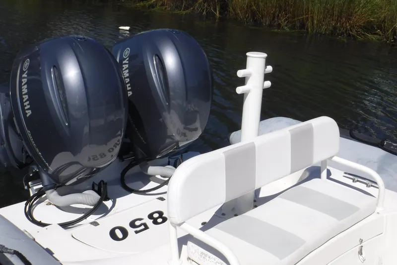 Slide: The Image of Zodiac 28 Pro Optimum 2015 boat with dual Yamaha outboard motors on water. - 2