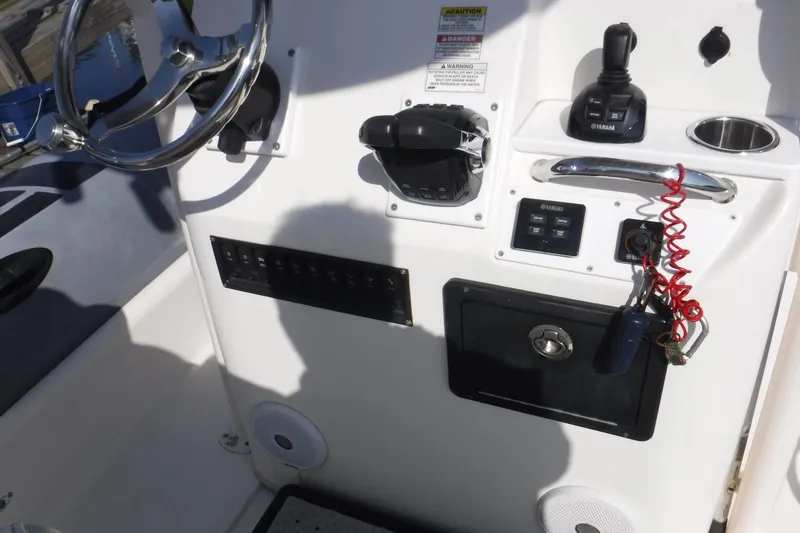 Slide: The Image of Control panel of 2015 Zodiac 28 Pro Optimum boat with steering wheel and controls. - 4