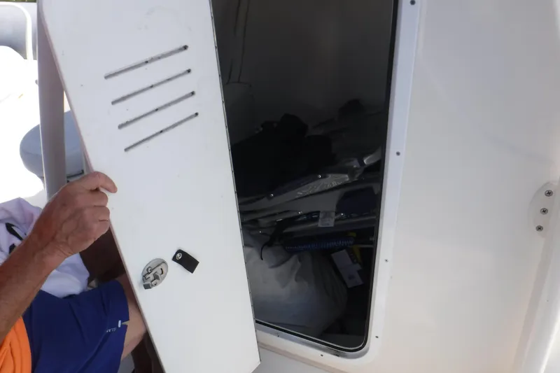 Slide: The Image of Open storage compartment on 2015 Zodiac 28 Pro Optimum boat. - 7