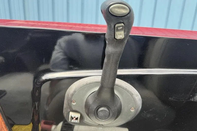 Slide: The Image of Control lever on a 2005 Triton TR 19 X boat dashboard. - 21
