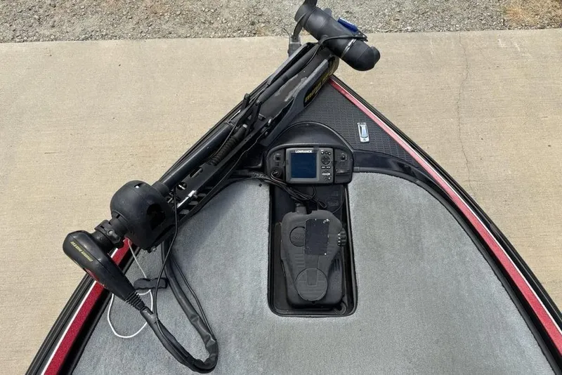 Slide: The Image of 2005 Triton TR 19 X boat deck with trolling motor and Lowrance fish finder. - 4