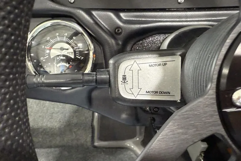Slide: The Image of 2025 Skeeter ZXR20 dashboard with RPM gauge and motor control switch. - 11