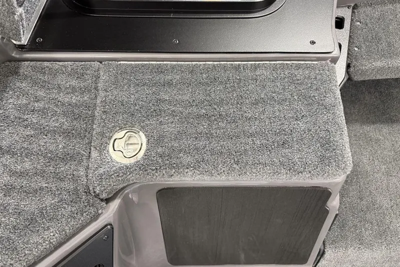 Slide: The Image of Carpeted interior of 2025 Skeeter ZXR20 boat with storage compartment. - 12