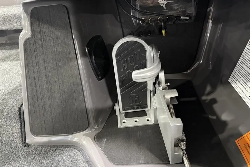 Slide: The Image of Hot Foot throttle in 2025 Skeeter ZXR20 boat cockpit, featuring sleek design and controls. - 17