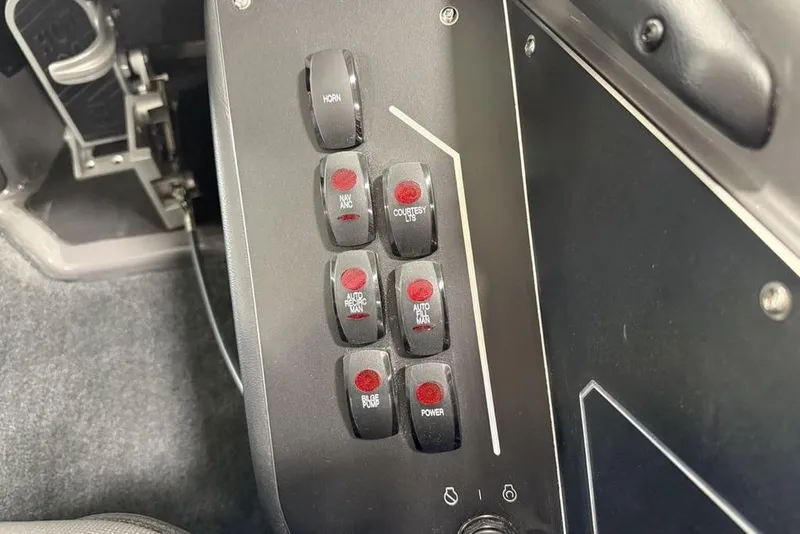 Slide: The Image of Control panel of a 2025 Skeeter ZXR20 boat with labeled switches. - 20