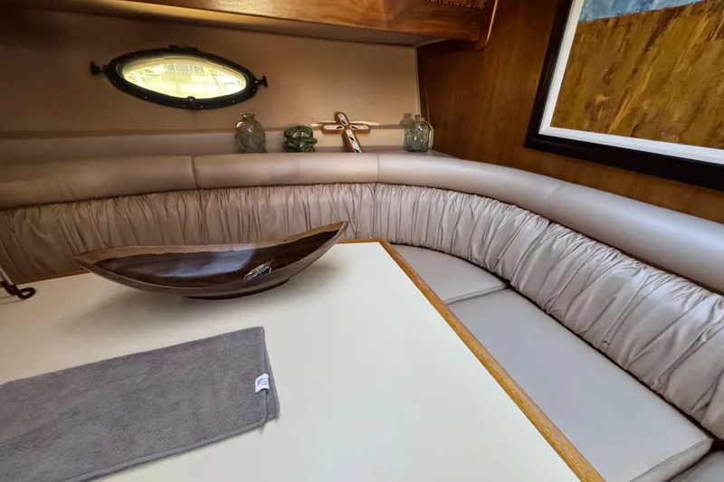 Slide: The Image of Cozy interior of a 1986 Californian 42 yacht with elegant seating and decor. - 14