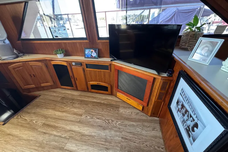 Slide: The Image of Interior of a 1986 Californian 42 yacht with wood paneling and modern decor. - 17