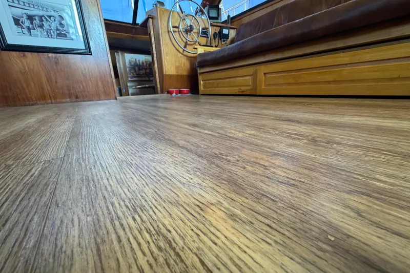 Slide: The Image of Interior of 1986 Californian 42 yacht with wooden flooring and helm station. - 27