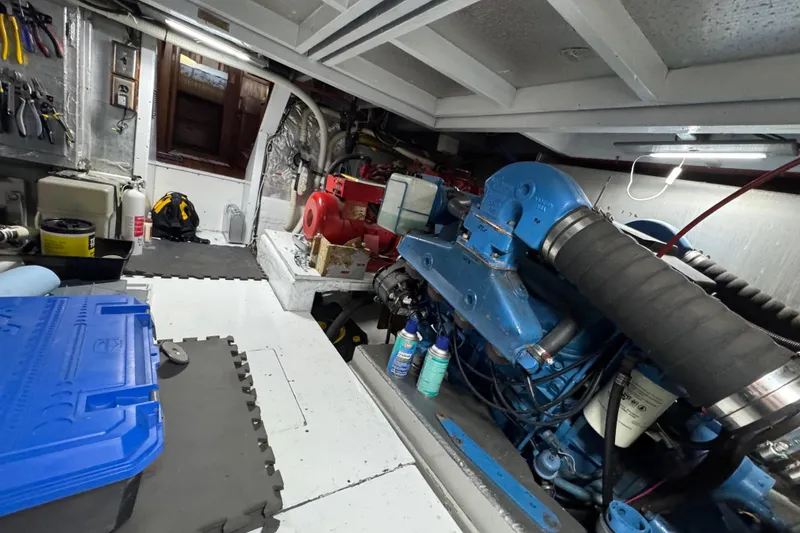 Slide: The Image of Engine room of a 1986 Californian 42 yacht with tools and equipment. - 34
