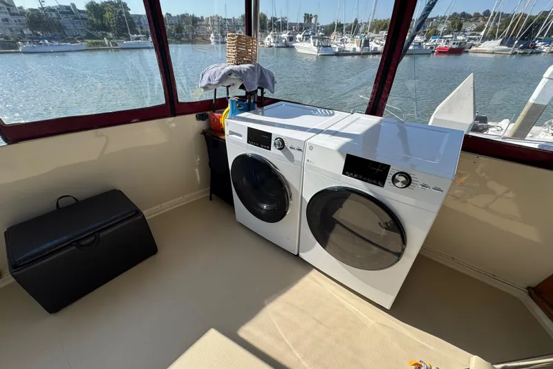 Slide: The Image of Laundry appliances on a 1986 Californian 42 yacht with marina view. - 36