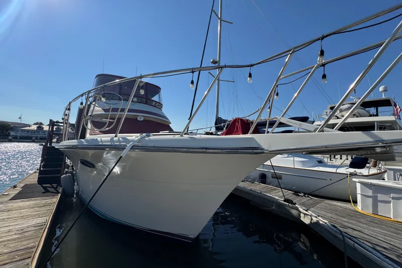 Slide: The Image of 1986 Californian 42 yacht docked at marina under clear blue sky. - 4