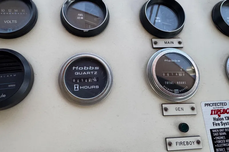 Slide: The Image of Control panel of a 1986 Californian 42 boat with Hobbs hour meters and gauges. - 48