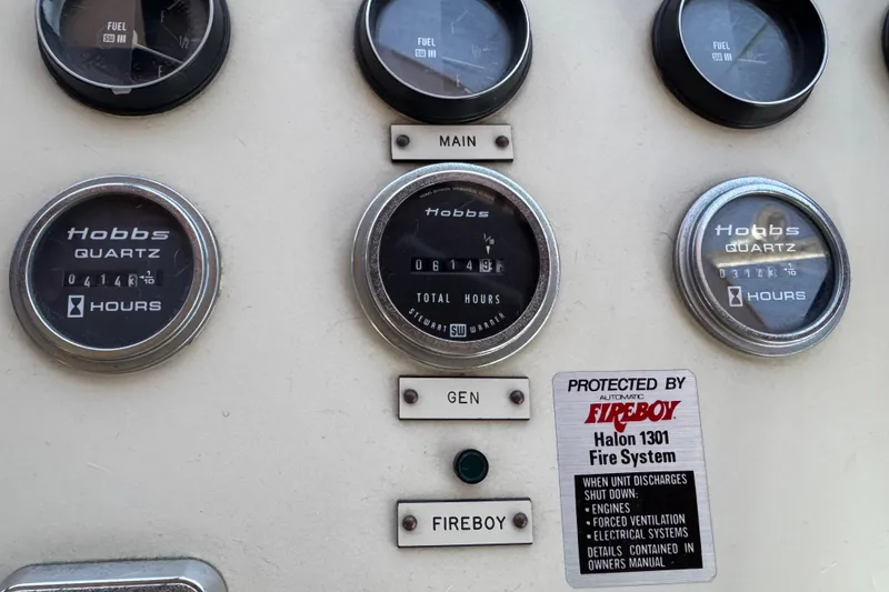 Slide: The Image of Control panel of a 1986 Californian 42 with Hobbs Quartz hour meters and Fireboy system. - 50