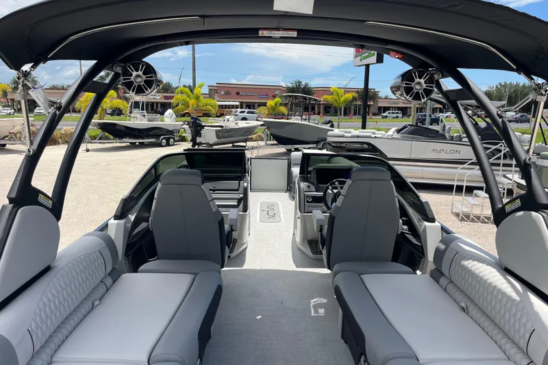 Slide: The Image of Interior view of 2026 Avalon 2785 Excalibur LTD boat with luxurious seating and modern controls. - 10