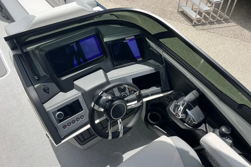 Slide: The Image of Helm of 2026 Avalon 2785 Excalibur LTD with advanced controls and dual displays. - 11